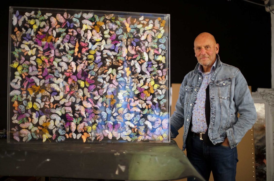 Michael Olsen standing next to his Butterfly Art